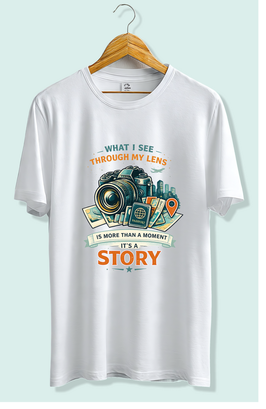 White graphic tee with camera design, 'What I see through my lens is more than a moment, it's a story'